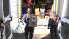 Pastor Daren Miller unloading donated food for his Haverford church's food pantry.