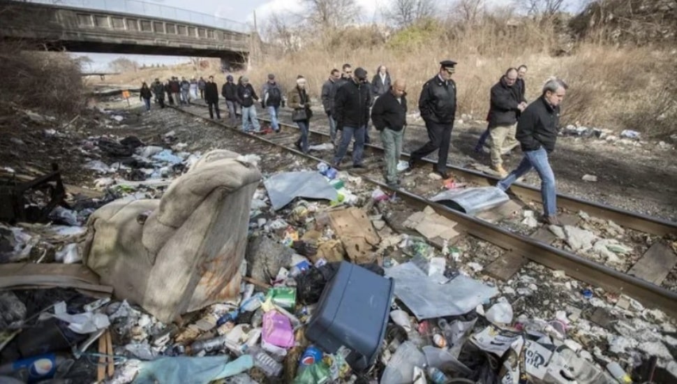 Politicians, law enforcement and reporters walk an open-air drug market in Kensington.