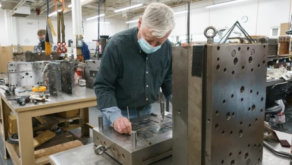 Bob Shafer, a toolmaker at the Rodon Group in Hatfield, and Richard Webb (left), a mold technician.