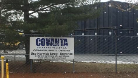 Fence and sign outside the Covanta Trash-to-Energy plant in Chester.