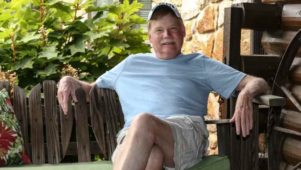 man sitting on green cushion