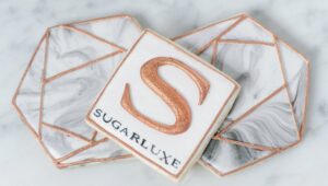 The Sugarluxe logo in a cookie.