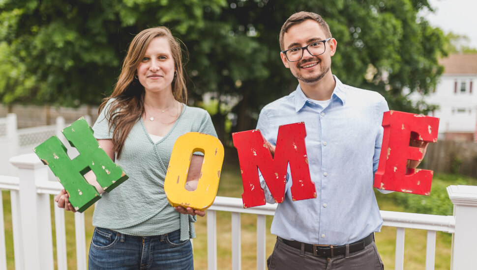 A happy couple celebrate home ownership