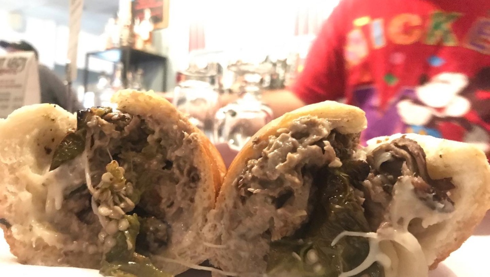A cheesesteak cut in half.