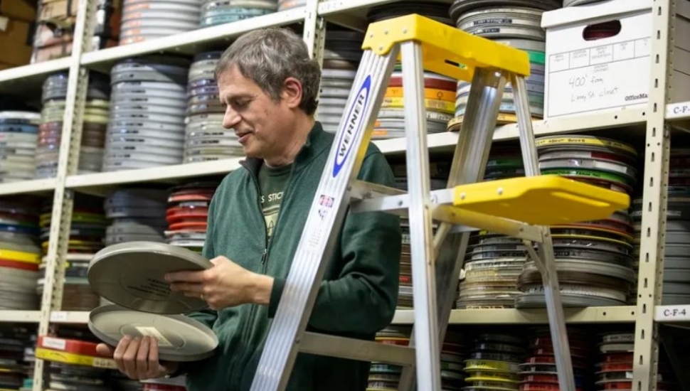Jay Schwartz looks at a film at the Secret Cinema Workshop.