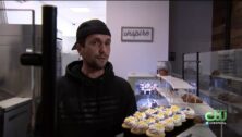 Illya Zayarchenko, owner of Ardour Bakery, withh a plate of cupcakes.
