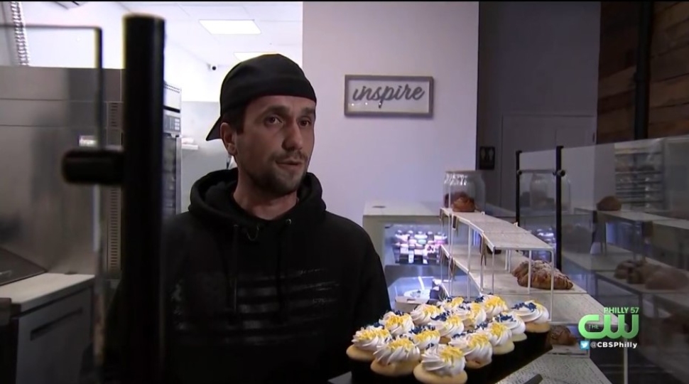 Illya Zayarchenko, owner of Ardour Bakery, withh a plate of cupcakes.