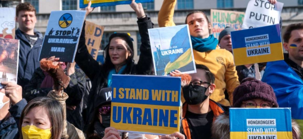 People with signs supporting Ukraine.