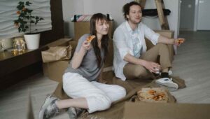 man and woman with pizza