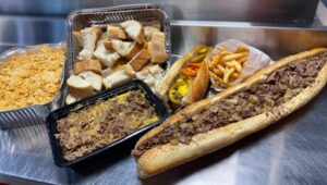 Cheesesteaks, bread and buffalo chicken dip from Delco Steaks