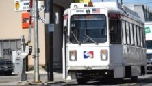 A SEPTA trolley approaches the Sixth and Main crossing in Darby.