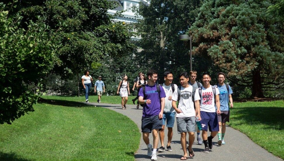 Swarthmore College students walking on campus.