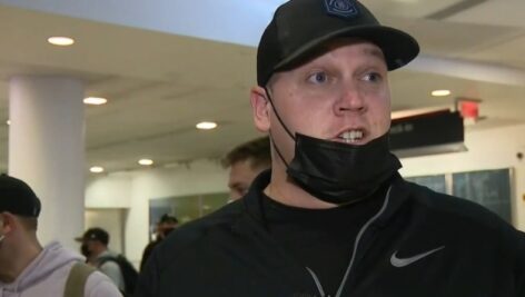 A Philadelphia International Airport passenger talking about wearing masks.
