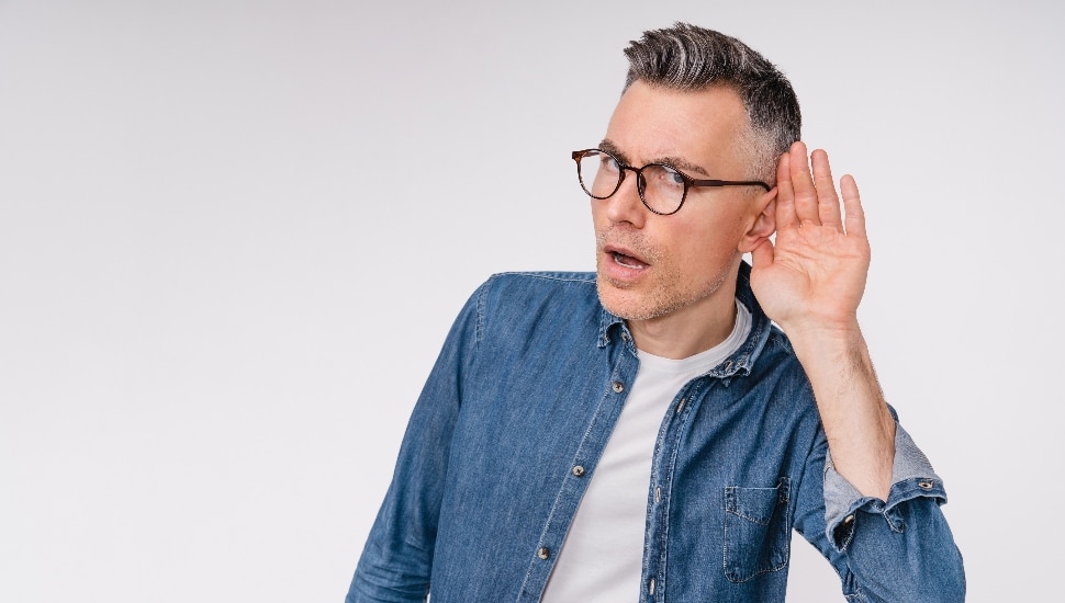 Man in casual clothes listening closely
