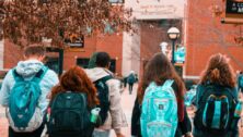 higher education students gathering on campus.