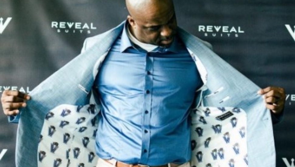 Carlton Dixon modeling a suit jacket.