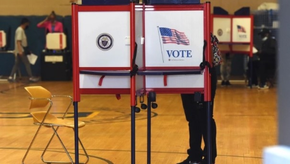 A voter fills out his ballot at Bell Avenue School in Yeadon.
