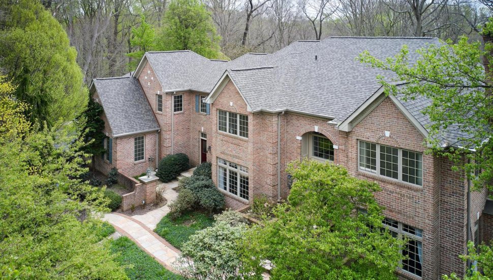 Overview of the brick colonial at 2 Windbrook Drive in Springfield.