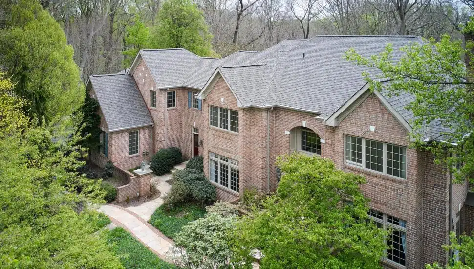 Overview of the brick colonial at 2 Windbrook Drive in Springfield.