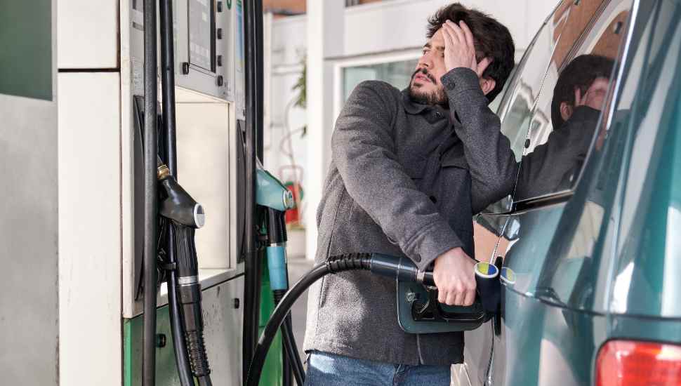 man next to car