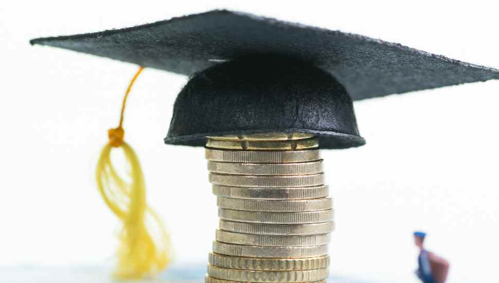 mortar board with coins