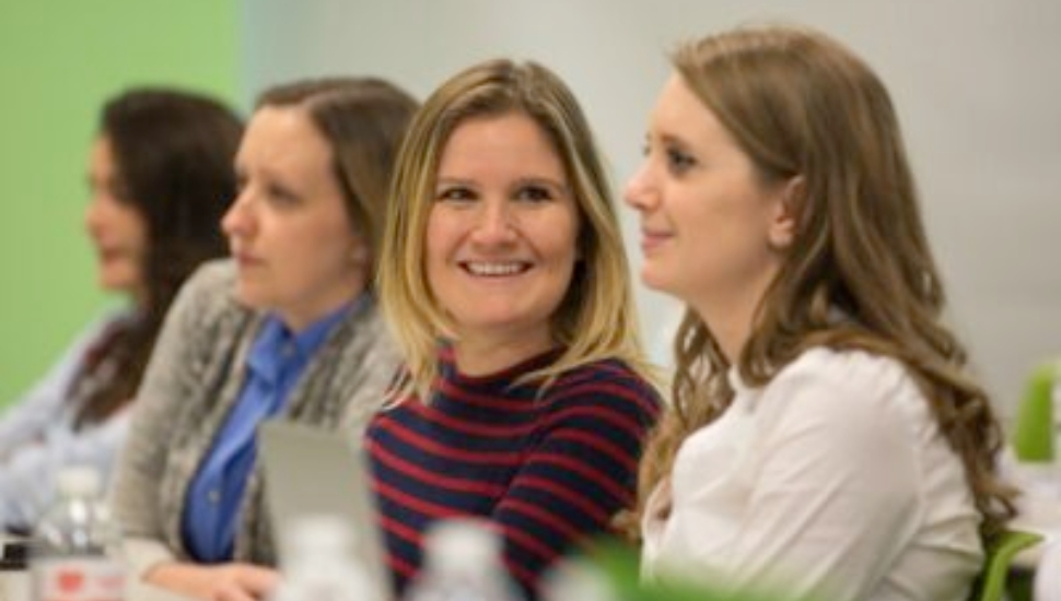 Four women in a meeting at Power Home Remodeling.