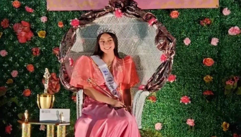 Ridley High student Leilani Hencinski sits at her Miss Philippines coronation.