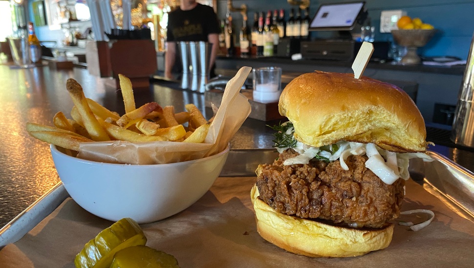 A Sloppy Joe sandwich, fries and pickles