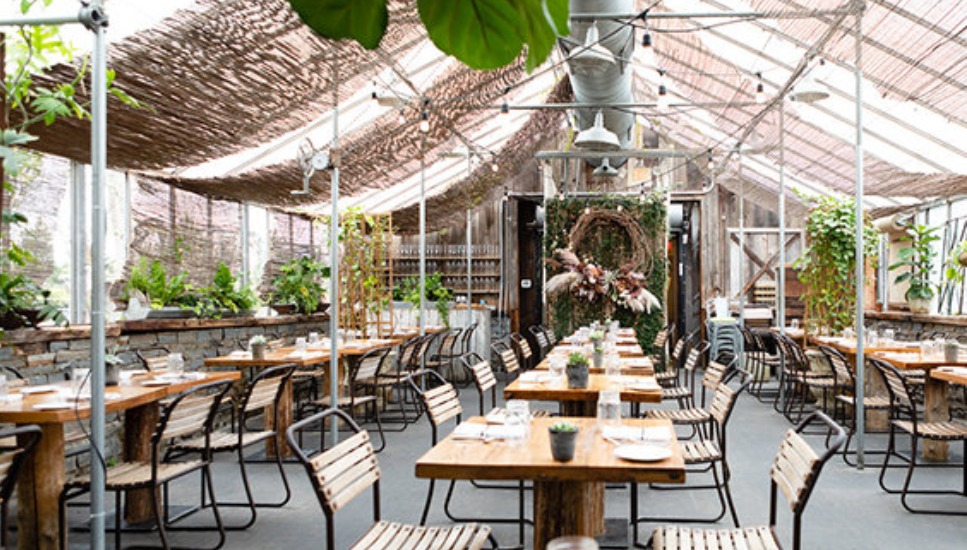 An indoor/outdoor dining scene at Terrain Cafe.