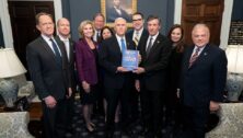 Members of the Semiquincentennial Commission present then Vice President Mike Pence the commission's report.