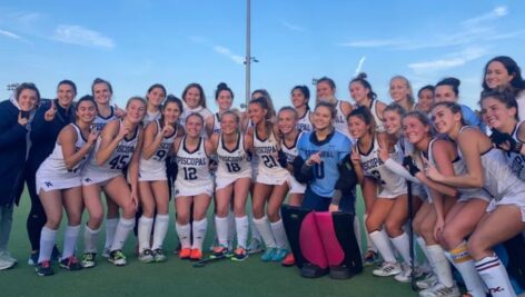 The Episcopal Academy field hockey team in a victory pose.