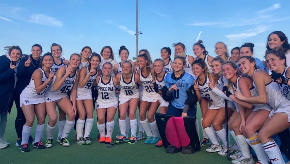 The Episcopal Academy field hockey team in a victory pose.
