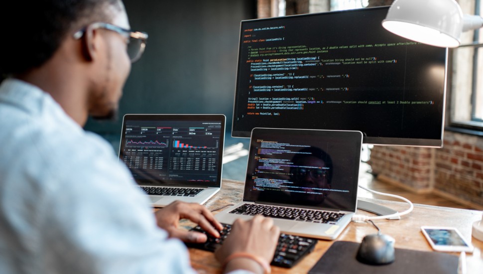 A programmer working at a computer.