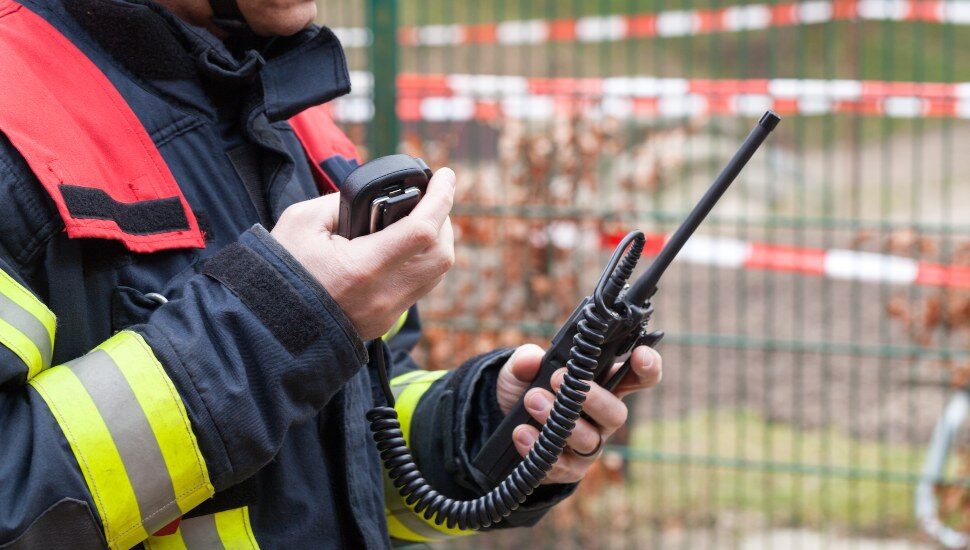 Firefighter using 911 portable radio