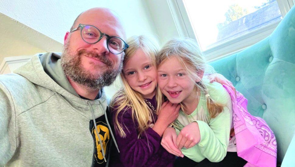 Dario Mesca with his daughters Isabel, 6, and Eliotte, 8.