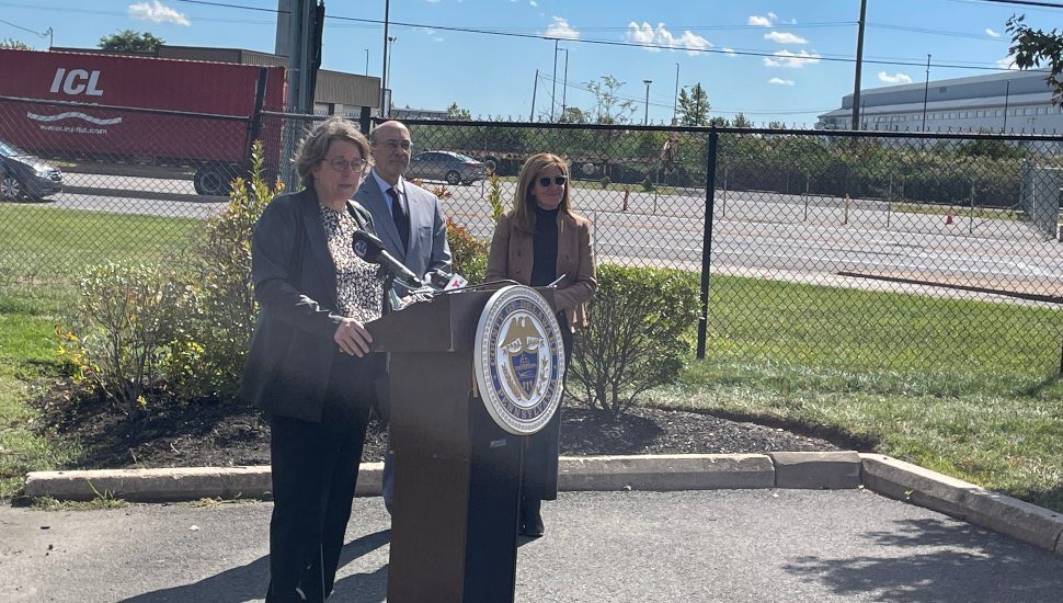 Delaware County Vice Chairman Elaine Shaeffer (at podium) speaks to reporters Tuesday about safety concerns for Route 291 behind her. With Shaeffer are Barry Seymour and Christine Reuther.