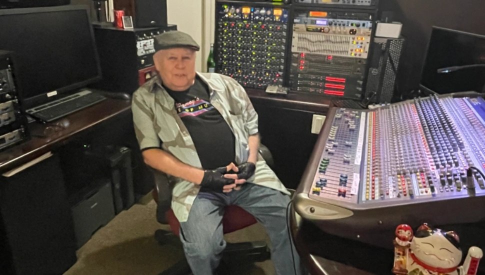 Jamey Reilly owner of Jamey's House of Music, surrounded by his state-of-the-art sound equipment.