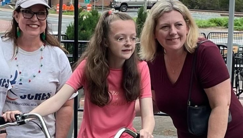 Mady and friends with her new adaptive bike