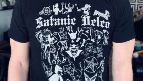 A person wearing a Satanic Delco T-shirt