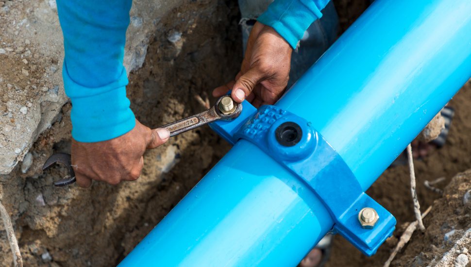 man working on water main replacement projects