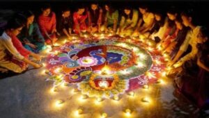 Gathering around a rangoli during a Diwali, or Festival of Lights, celebration