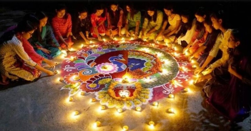 Gathering around a rangoli during a Diwali, or Festival of Lights, celebration