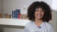 Delco teen smiling in front of shelf in her resource closet