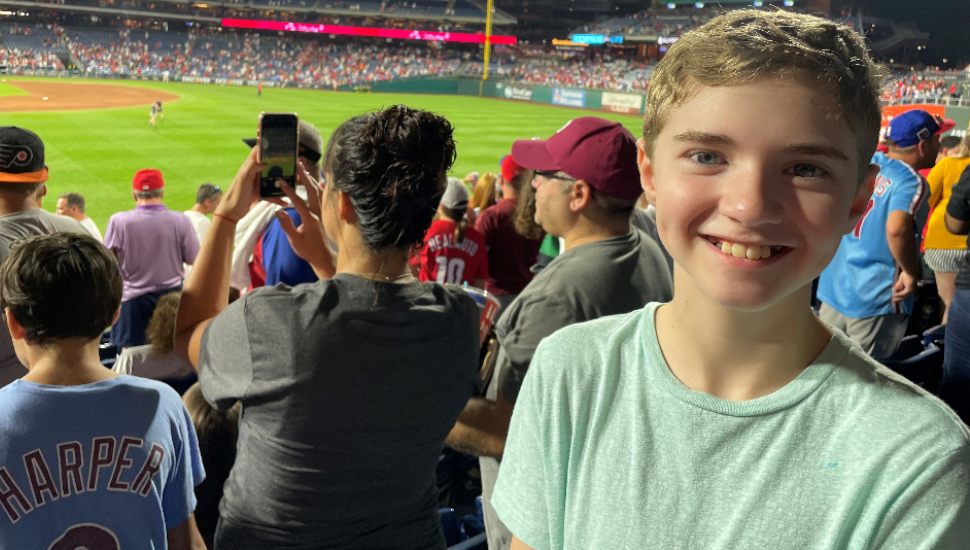 smiling boy in green t-shirt