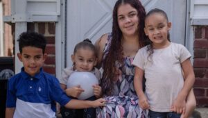 Keshla Cruz outside her home with her three children,