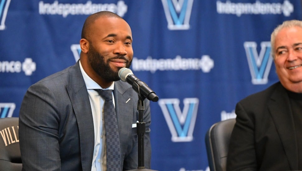 Kyle Neptune at a press conference