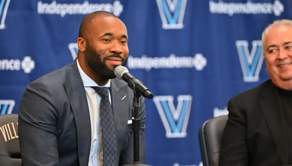 Kyle Neptune at a press conference