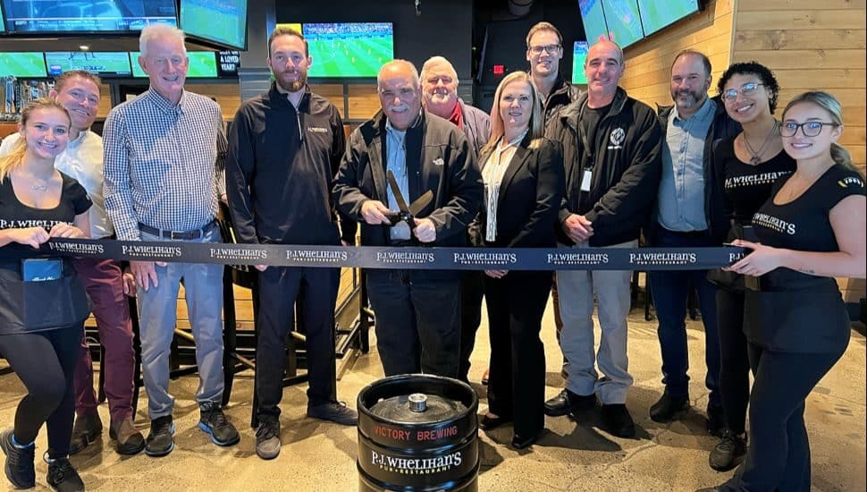 The ribbon cutting ceremony Nov. 28 at the new P.J. Whelihan's Pub in the Lawrence Park Shopping Center