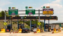 Denver, PA, USA – June 20, 2016: Vehicles approach the entrance toll plaza at the Pennsylvania Turnpike Interchange.
