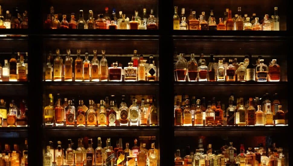 Store shelves filled with whiskey bottles